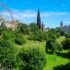 Ferris wheel and Scott monument in park in Edinburgh