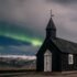 Northern lights aurora borealis over Black church in Iceland